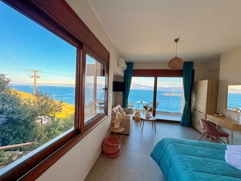 Sunny studio with sweeping sea views, balcony seating, and chic comfort.