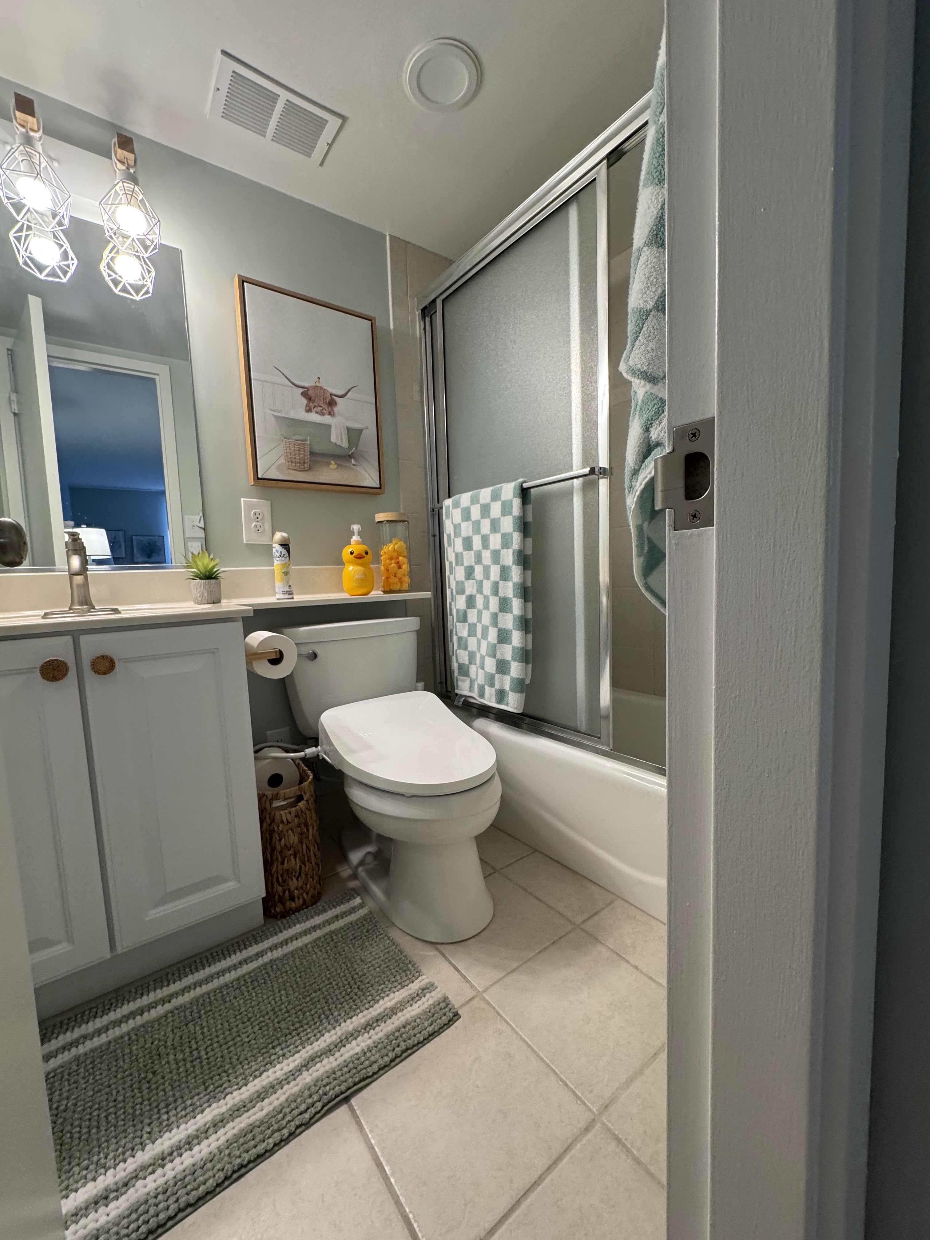 Bath attached to the primary bedroom. Tub with shower. Toilet with bidet.