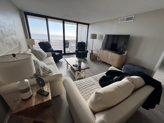 Living room with beach and ocean views.