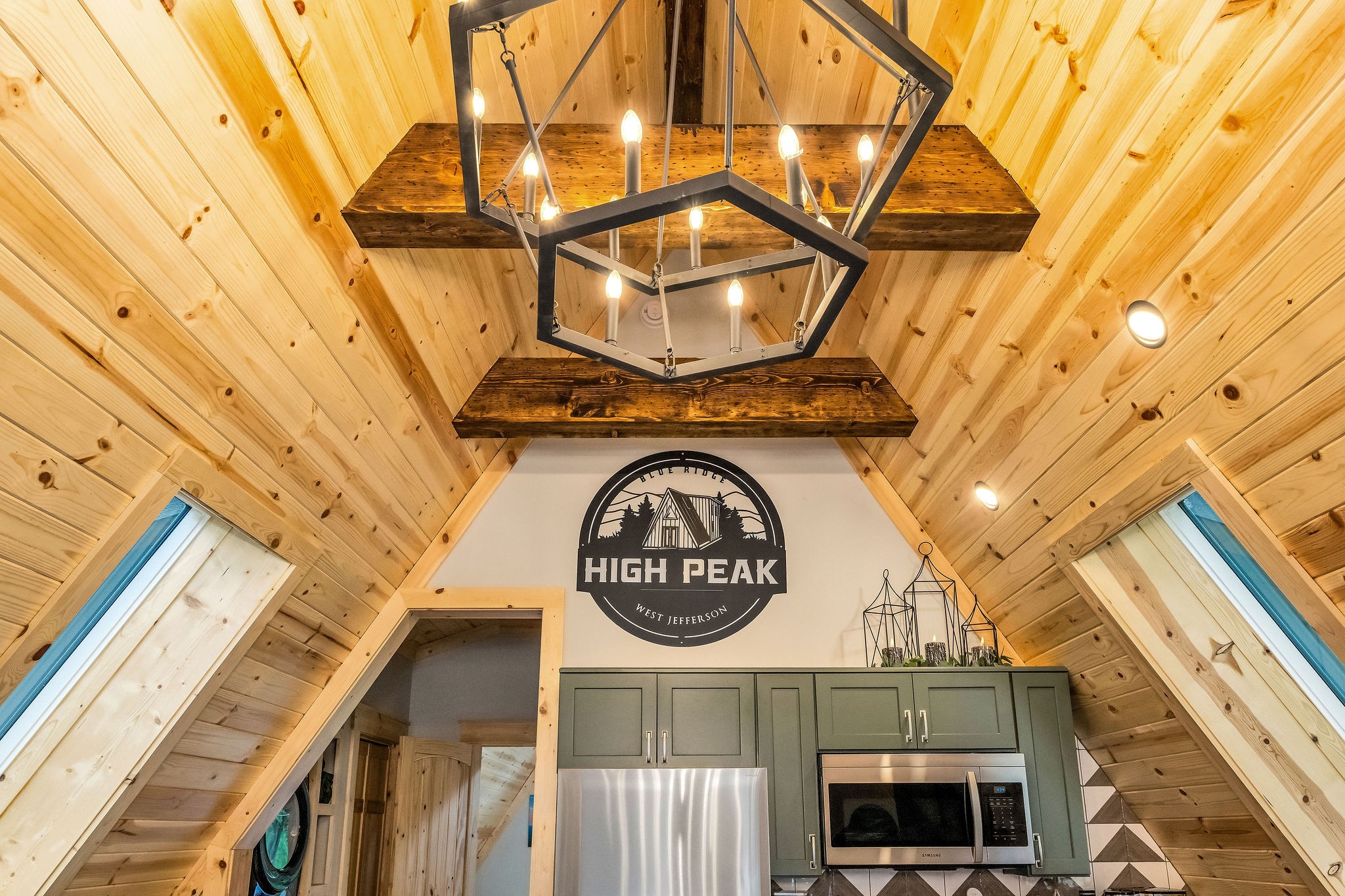 Chandelier and Logo of High Peak Chandelier and Logo of High Peak - High Peak Aframe Cabin - West Jefferson