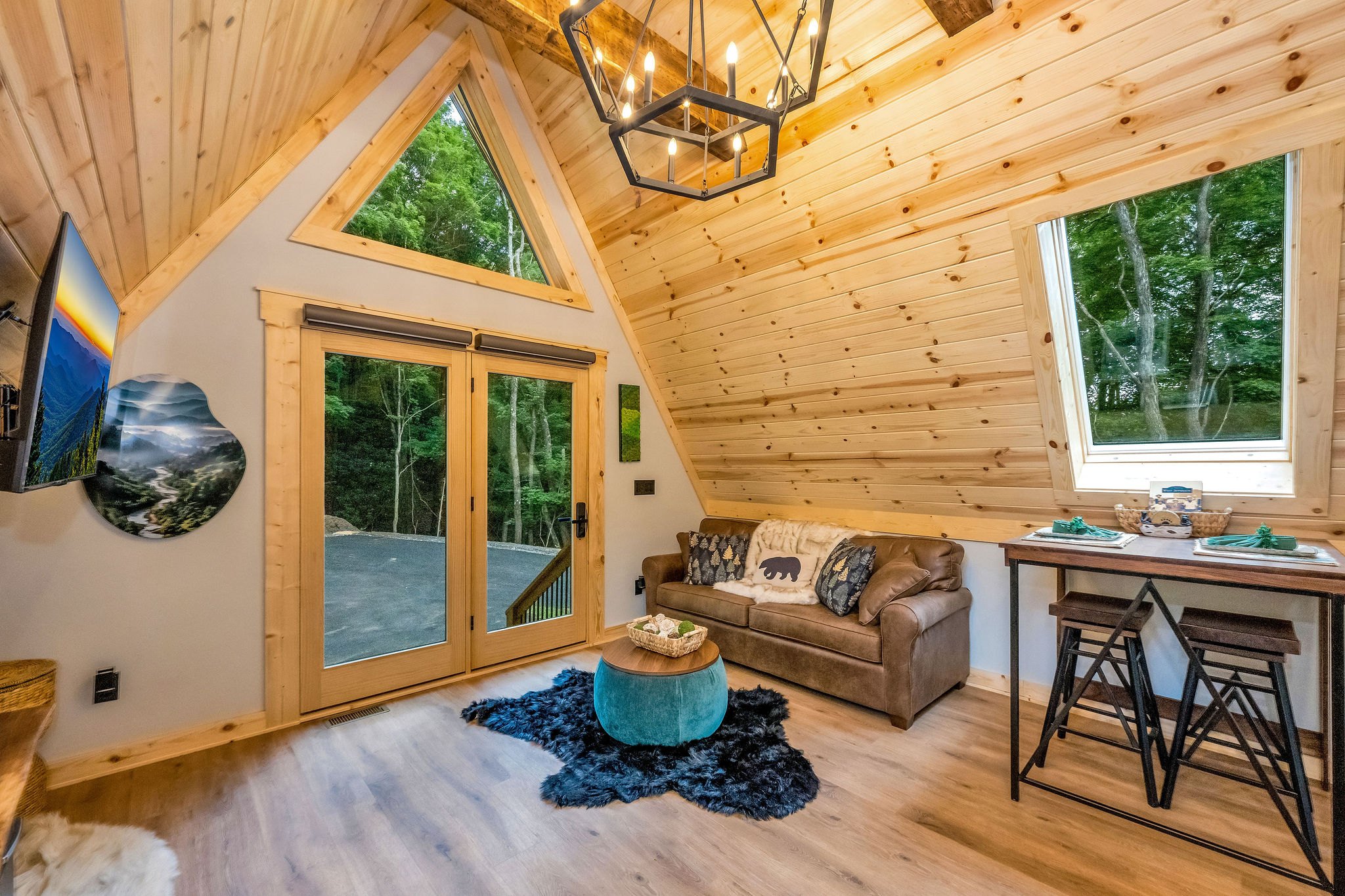 Showing Front door and Queensize pull out Couch for additional sleeping Showing Front door and Queensize pull out Couch for additional sleeping - High Peak Aframe Cabin - West Jefferson