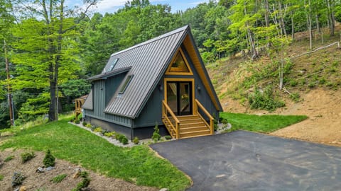 Front view of Aframe Cabin and parking