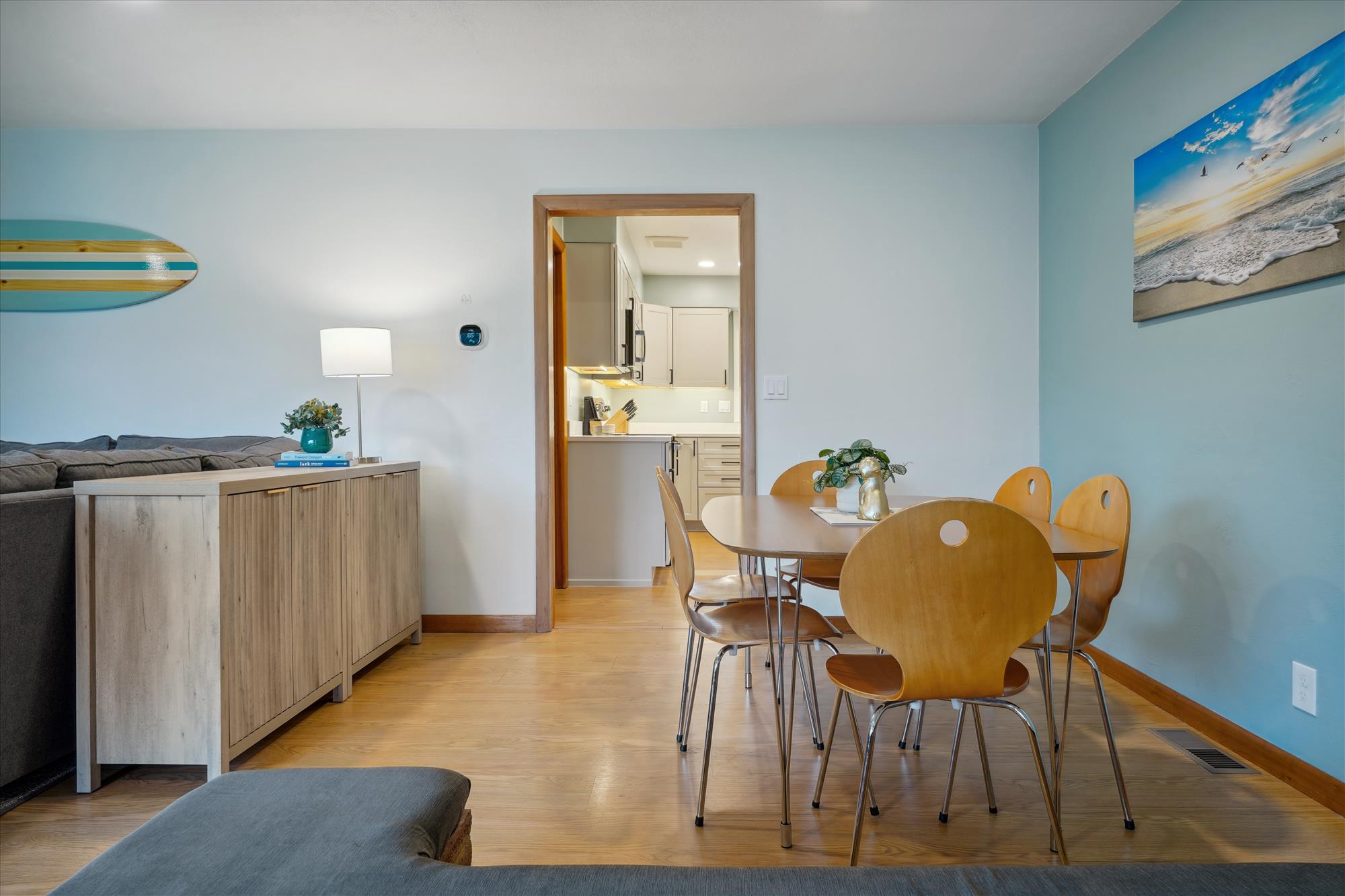 Enjoy meals and conversation in the bright, open dining area, perfect for family gatherings or a cozy dinner after a day at the beach