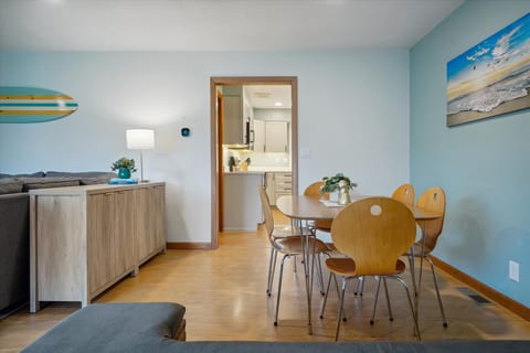 Enjoy meals and conversation in the bright, open dining area, perfect for family gatherings or a cozy dinner after a day at the beach
