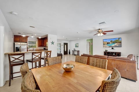 View from dining area of whole house. Sliders to the pool