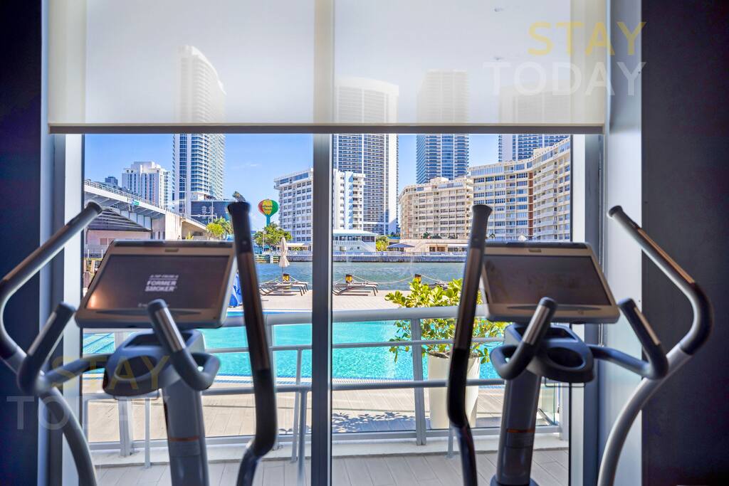 Close-up view of the treadmill in the gym, offering a great workout while enjoying a scenic poolside view. Stay active and take in the relaxing atmosphere right from your fitness routine.