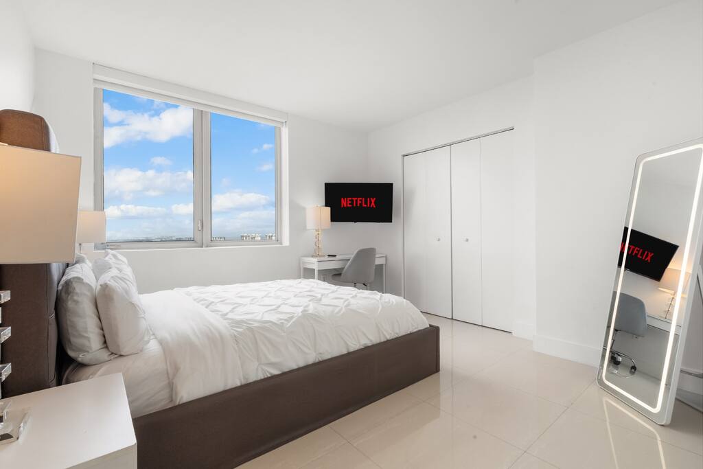 Thoughtful design details and bright windows bring warmth to the room, offering a refreshing place to begin and end the day.