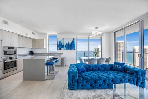 Sleek oceanview condo with floor-to-ceiling windows and chic decor