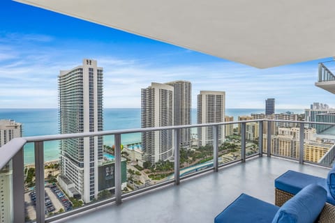 Step out onto the balcony and take in the expansive views of the ocean and city skyline. Relax on the comfortable seating as you enjoy the fresh sea breeze and vibrant surroundings, creating the perfect spot to unwind and recharge.