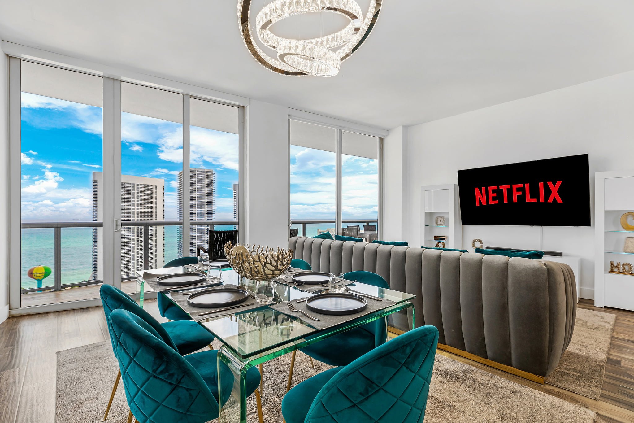 Stylish high-rise condo with ocean views, chic dining, and big-screen TV