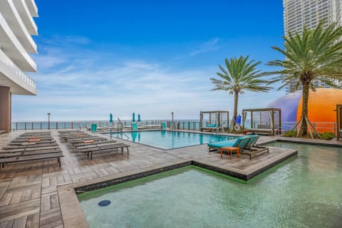 Enjoy a calm spot to unwind in the shallow wading pool - perfect for cooling off, dipping your feet, or simply relaxing by the palm-lined terrace.