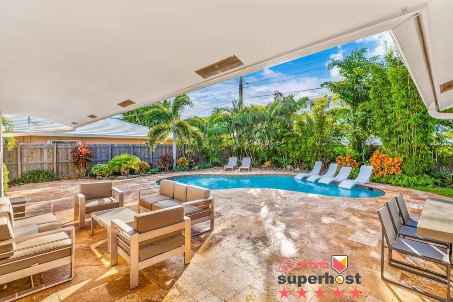 Step outside to your private tropical oasis, complete with a sparkling heated pool, comfortable lounge chairs, and shaded seating areas. Perfect for relaxing, entertaining, or simply soaking up the South Florida sun.