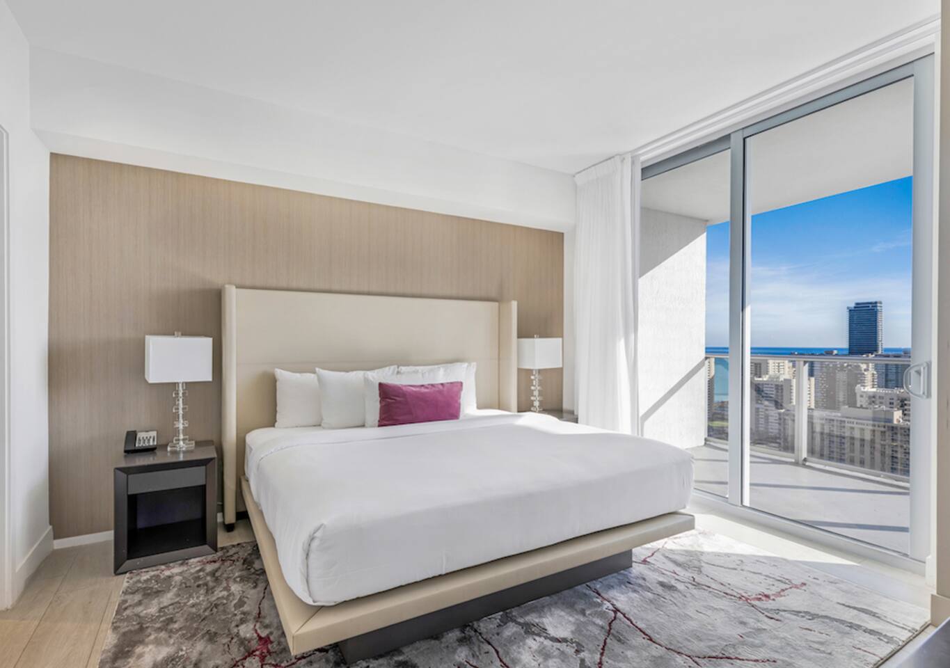After a day exploring the city, retreat to this spacious master bedroom with a king-size bed and calming decor. Enjoy fresh ocean breezes and stunning views from the balcony, creating a perfect spot to unwind and recharge.