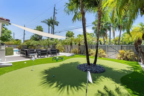 Practice your swing on the private putting green surrounded by lush palms, with plenty of space to enjoy outdoor games or relax in the shaded lounge area just steps away from the pool.