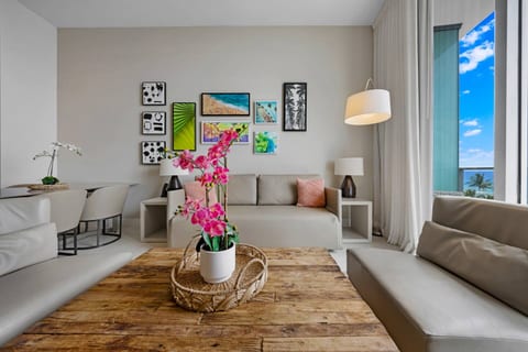 Sunlight and style meet in this open living space, designed with artistic details and cozy furnishings for your comfort.