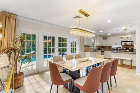 Spacious and inviting, the dining area sits at the heart of the home, offering a seamless flow between the kitchen and living room for effortless entertaining.