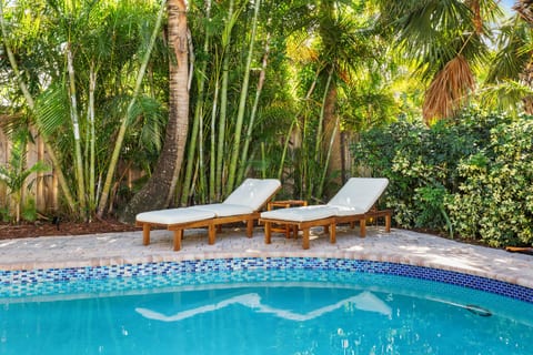 Perfect for lazy afternoons, the poolside loungers create a peaceful nook surrounded by nature.