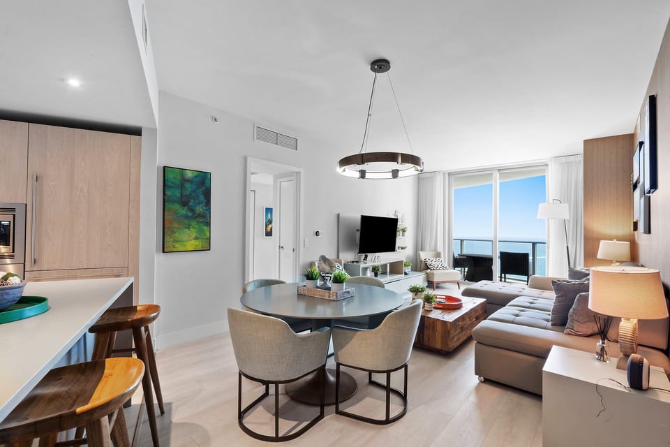 Bright coastal condo with balcony ocean view and chic open living