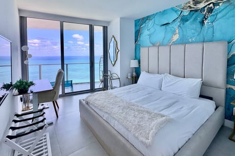 Step into luxury in the master suite, featuring a king-size bed, private bathroom, and direct balcony access. Expansive ocean views and stylish design create a restful escape.