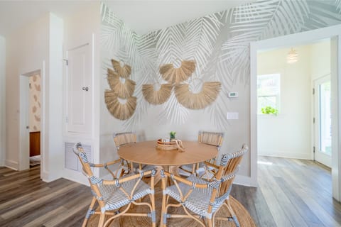 Dining table with a tropical touch—enjoy meals by the stylish palm tree accent wall