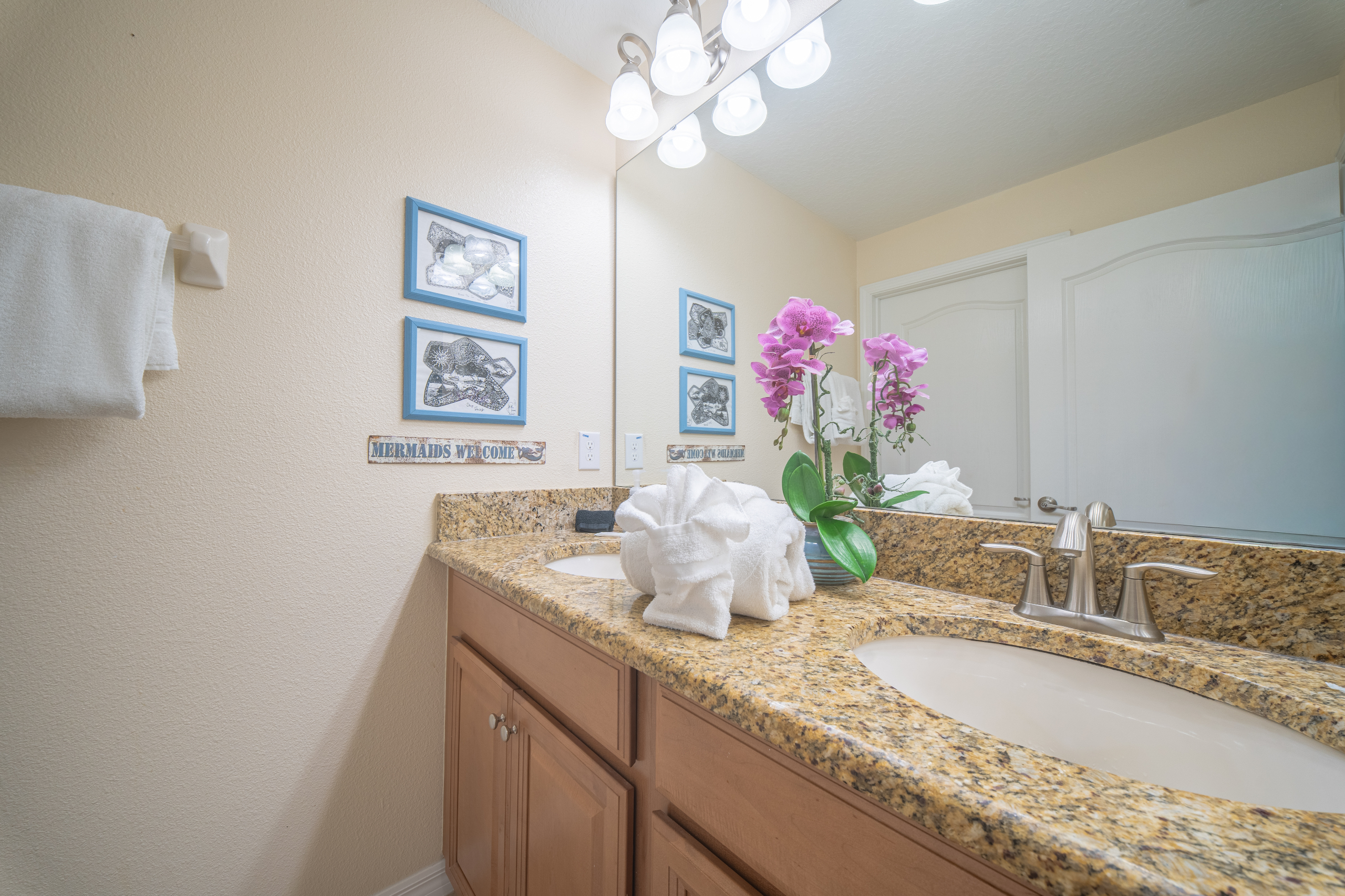 The themed rooms share this bathroom with private shower/toilet room making the most of the space, with double vanity, so more than one person can get ready at a time.