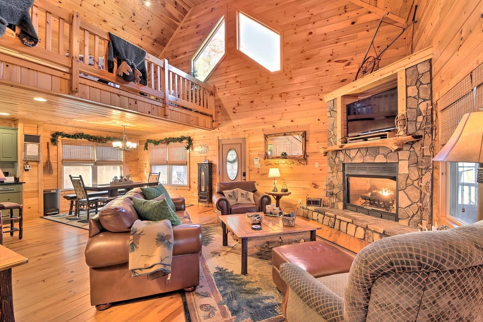 Embrace the warmth of the beautiful main floor living room! 🌟 The wood floors and fireplace create the perfect atmosphere for relaxation. #CozyCorner #HomeVibes