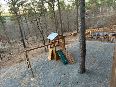 From playtime to fireside relaxation, our outdoor space has it all! Let the kids explore the playset while parents unwind by the fire pit – fun for everyone!