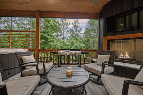 Curl up in one of four comfortable swivel chairs in front of the outdoor fireplace