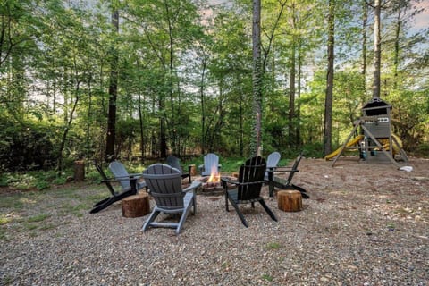 Warm up by a campfire with friends/family while the children play