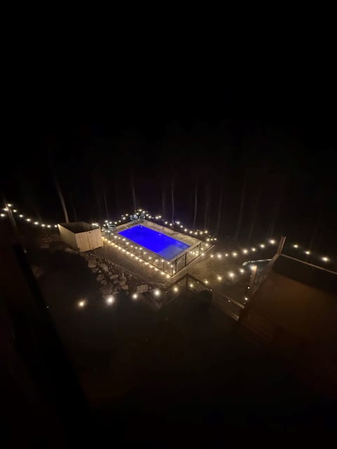 night transforms everything — warm lights, deep blue water, and complete privacy