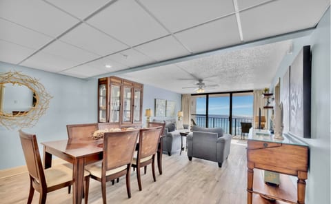 Spacious open-concept living and dining area with unbeatable views of the Gulf