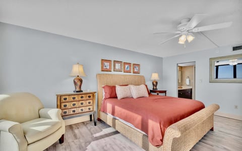 Wake up to panoramic Gulf views in the spacious master bedroom, complete with a king-size bed and cozy coastal decor.