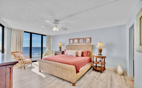 Wake up to panoramic Gulf views in the spacious master bedroom, complete with a king-size bed and cozy coastal decor.