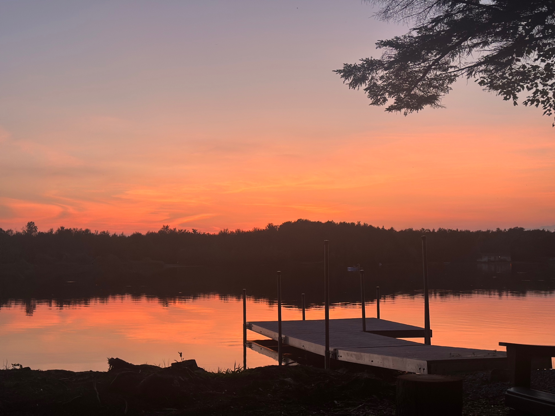 The sun sets over the lake every night 