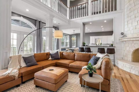 Whether you're being cozy on the couch, or relaxing on the bar stools; there is space for all. This great room is ideal for large families, get-togethers with friends, or even corporate events/retreats