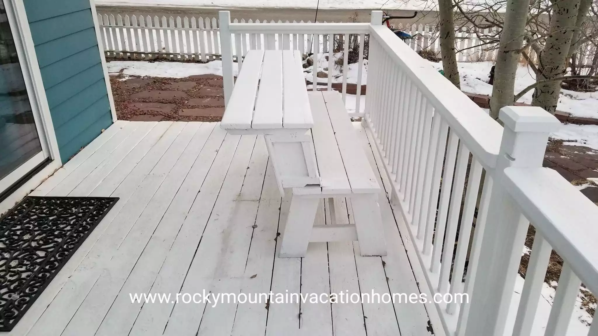 The benches on the back porch convert into a picnic table.