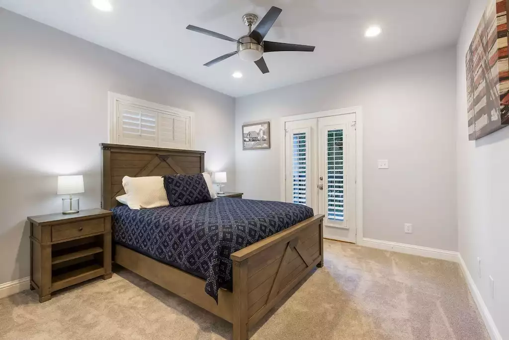 Bedroom #3 has access to a balcony overlooking the property. - Main House at Whispering Oaks Estate - Dripping Springs