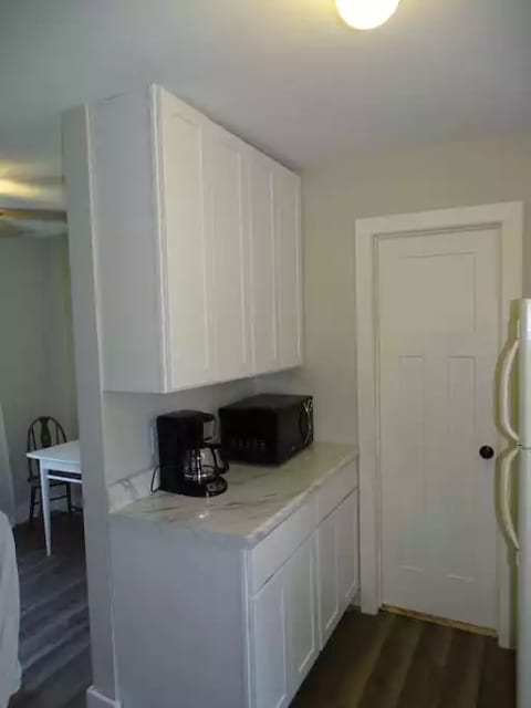 Full kitchen with microwave, coffee pot, and toaster.