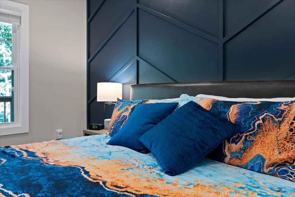 Discover Tranquility in our Master Bedroom with Striking Navy Blue Board and Batten Walls. Discover Tranquility in our Master Bedroom with Striking Navy Blue Board and Batten Walls. - Season 4 Escape - McGaheysville