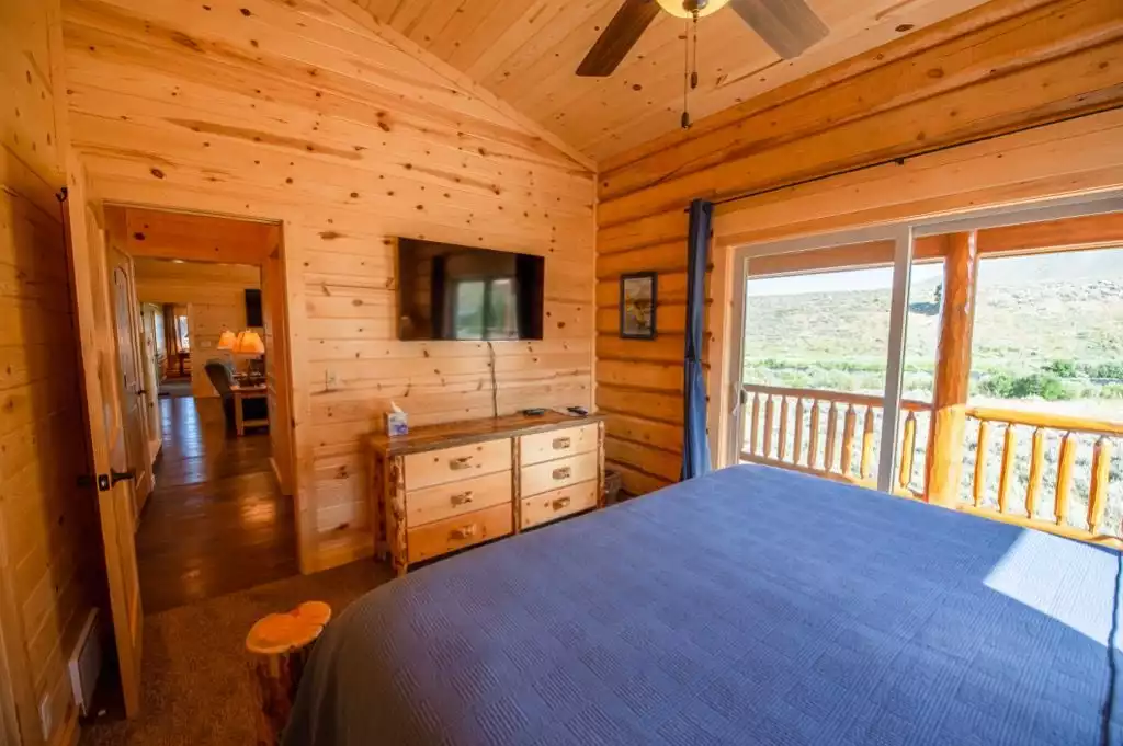 Bedroom #2 - Main floor Cal-King bed with slider to deck and river views.