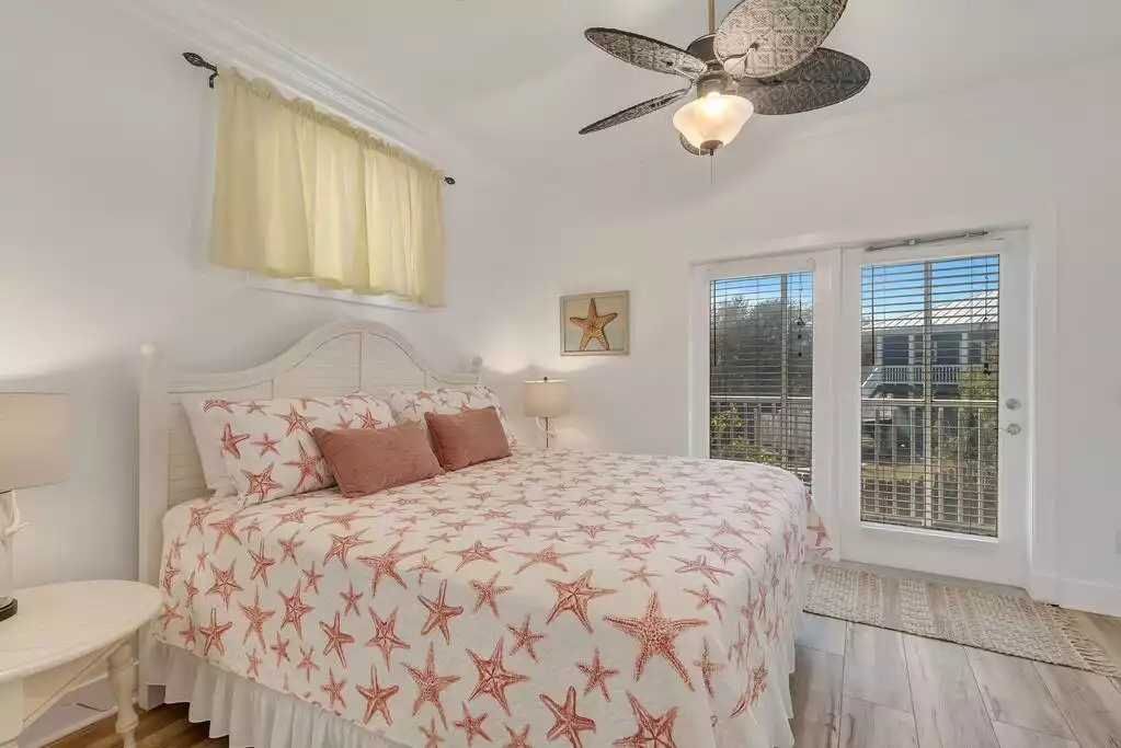 2nd Floor King Bedroom. This bedroom has a great enclosed balcony. - Beautifully Updated 5 BR with Pool on Beach! - Panama City Beach