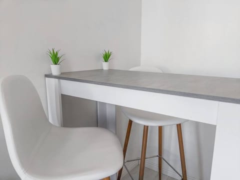 A clean place to eat, work or study. This is located right next to the beds.