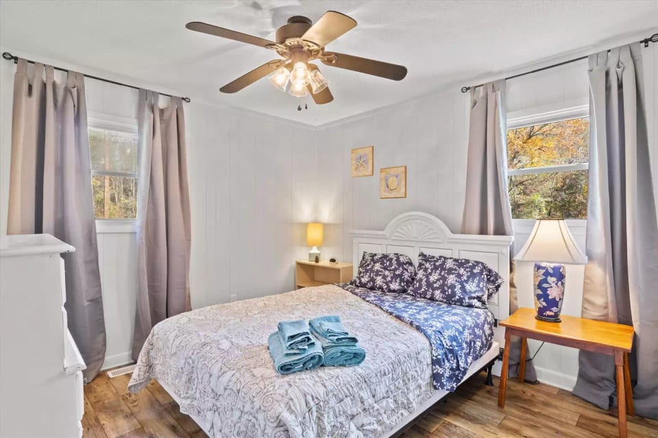 the master bedroom has 2 windows for days you want it to be bright and room-darkening curtains for quiet sleepy time...