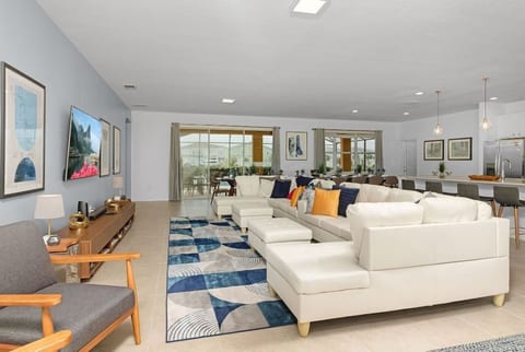 Huge Main Level Great Area with 70" $K Smart HDTV that opens to your private, screened swimming pool