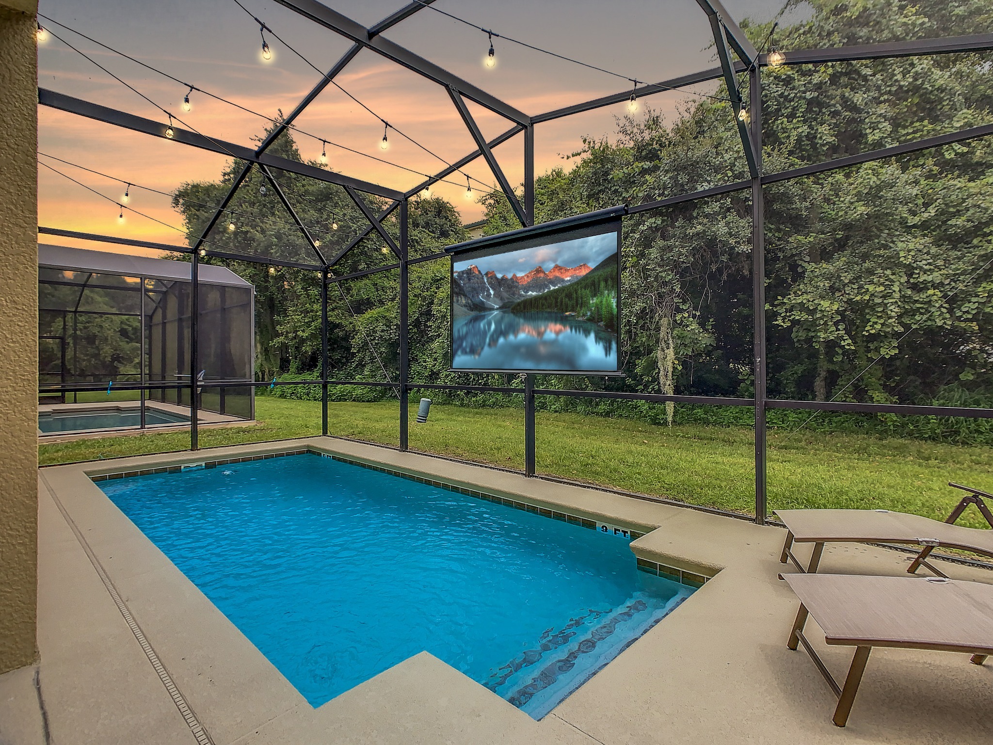 Enjoy an evening movie from the pool (additional fee applies. Inquire for more details). *photo edited to better demonstrate movie screen and outdoor lighting. Enjoy an evening movie from the pool (additional fee applies. Inquire for more details). *photo edited to better demonstrate movie screen and outdoor lighting. - 5mi Disney* Immersive Themes* Outdoor Pool & Movie - Kissimmee