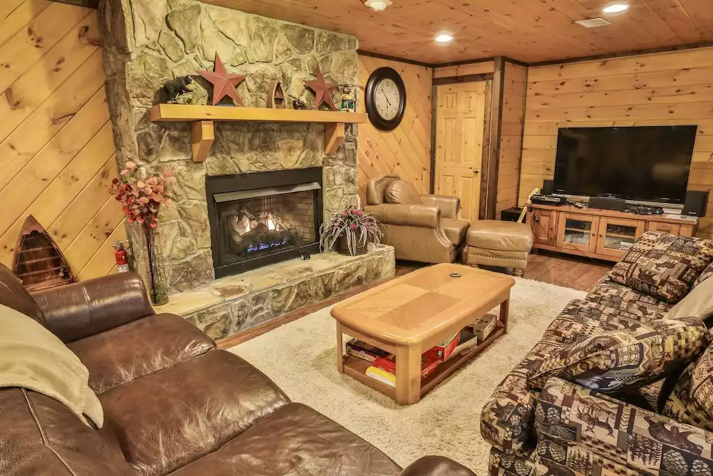 Media area with 55" HDTV, Playstation, BluRay, Wii, fireplace, and pullout sofa.