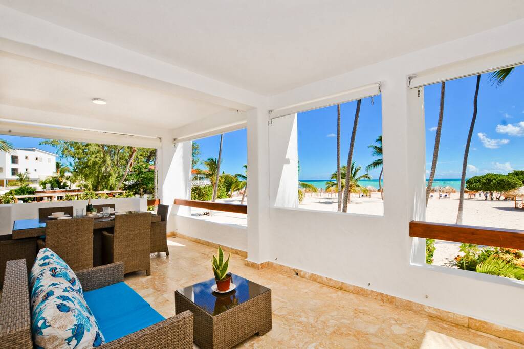 Nothing between you and the turquoise ocean except palm trees and sand. Very large deck has a BBQ and dining area plus other seating areas for relaxing and entertaining. - Luxury Condo with Stunning views, Private Beach - Punta Cana