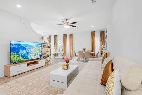 Large oversize couch to relax , living room, dining area , 75 inch smart TV with local cable and Netflix included.