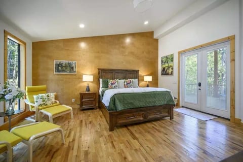 Windows have blackout roller shades and French doors have built-in blinds for restful sleep