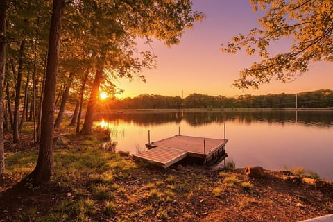 Golden hour hits different at the lake. Private dock, calm water, and a front row seat to sunrise mornings you never want to leave.